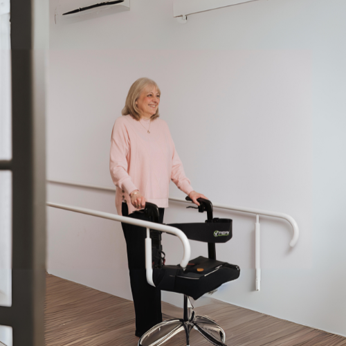 NDIS National Disability Insurance Scheme services.A senior woman using a mobility aid while walking